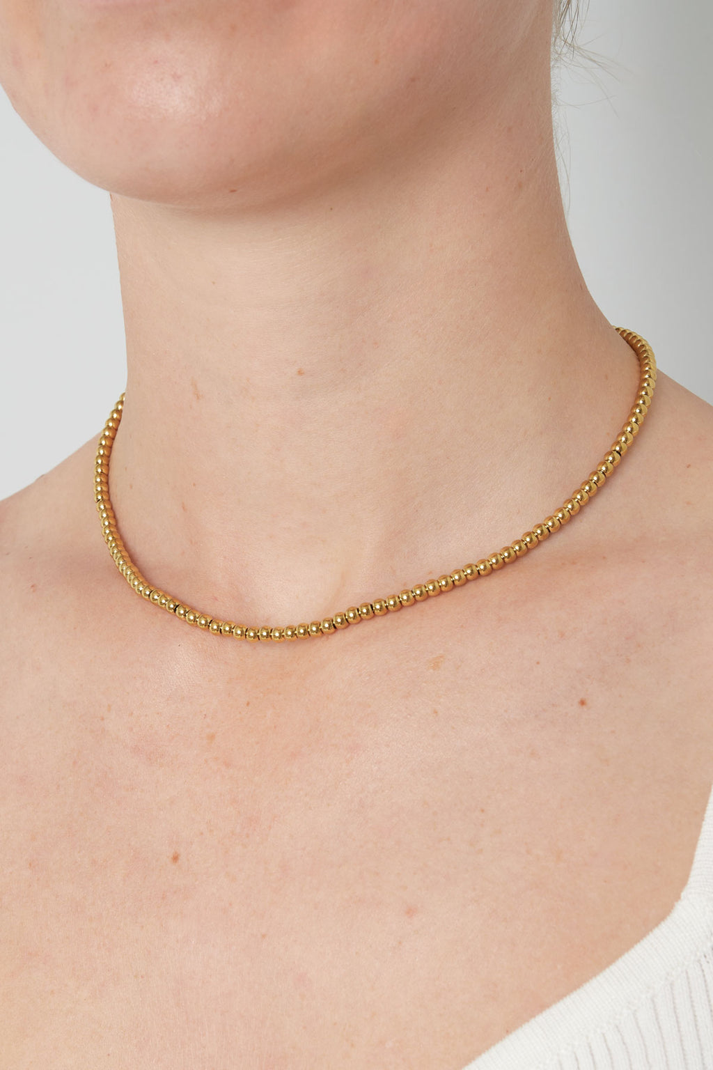 Bea - kralenketting Goud aan hals