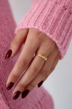 Amstrdm - bandring Goud aan hand