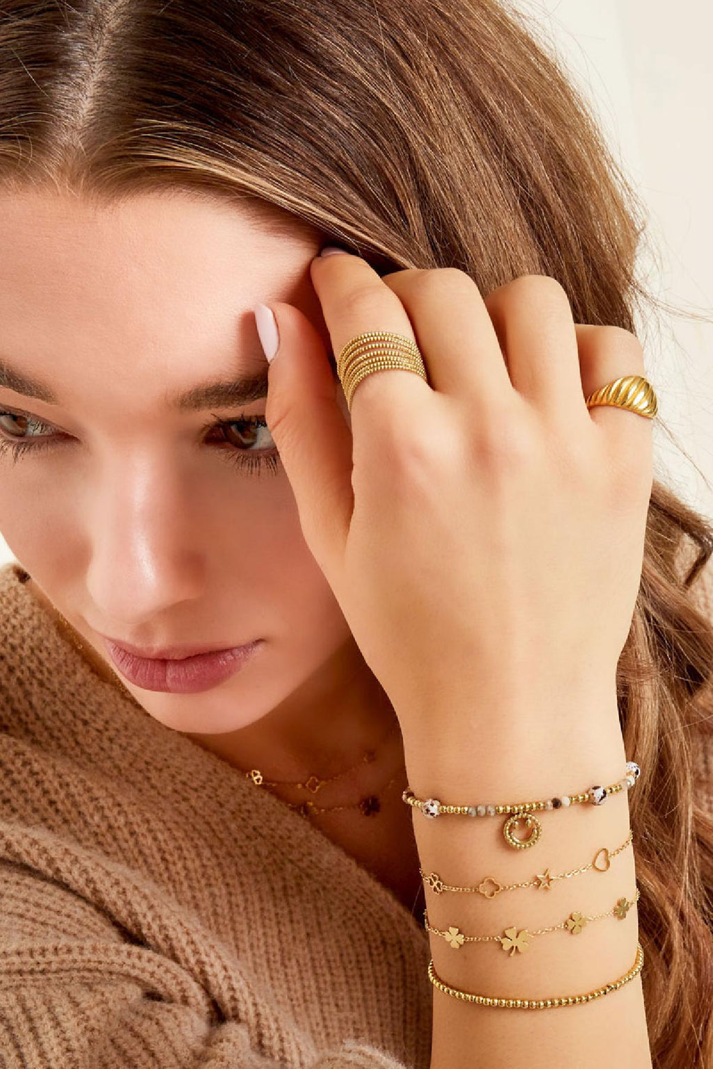 Fun - bedelarmband Goud aan pols