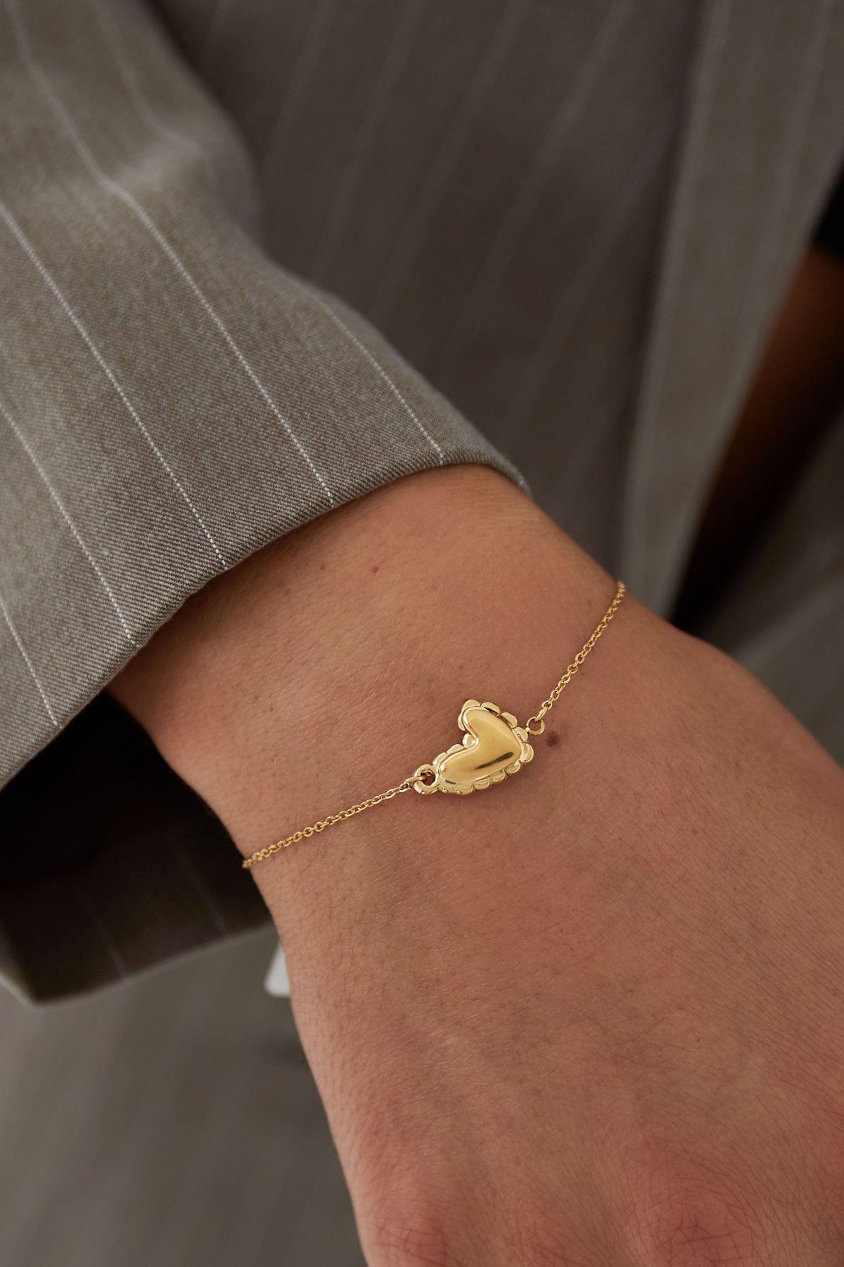 Crush - bedelarmband Goud aan pols