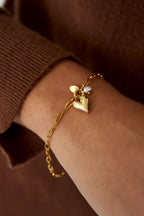 Adore - bedelarmband Goud aan pols