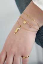 Pesce - bedelarmband Goud aan pols