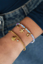 Sparkly Shell - schelp armband Goud aan pols