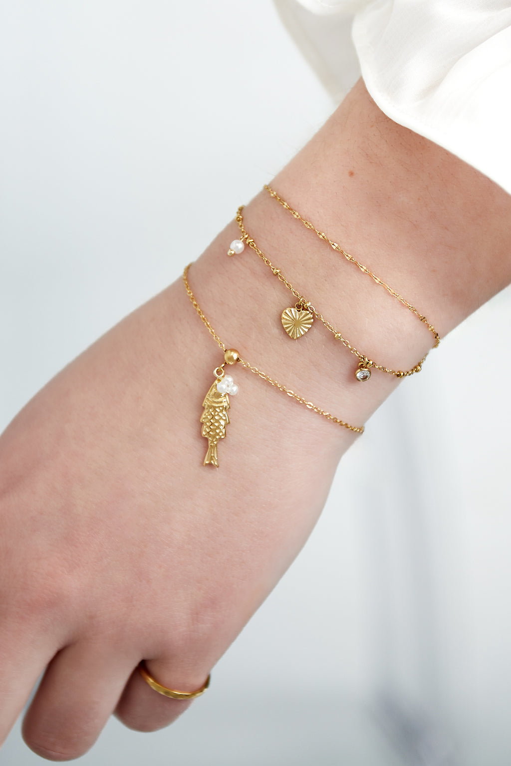 Loveline - bedelarmband Goud aan pols