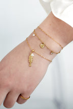 Loveline - bedelarmband Goud aan pols