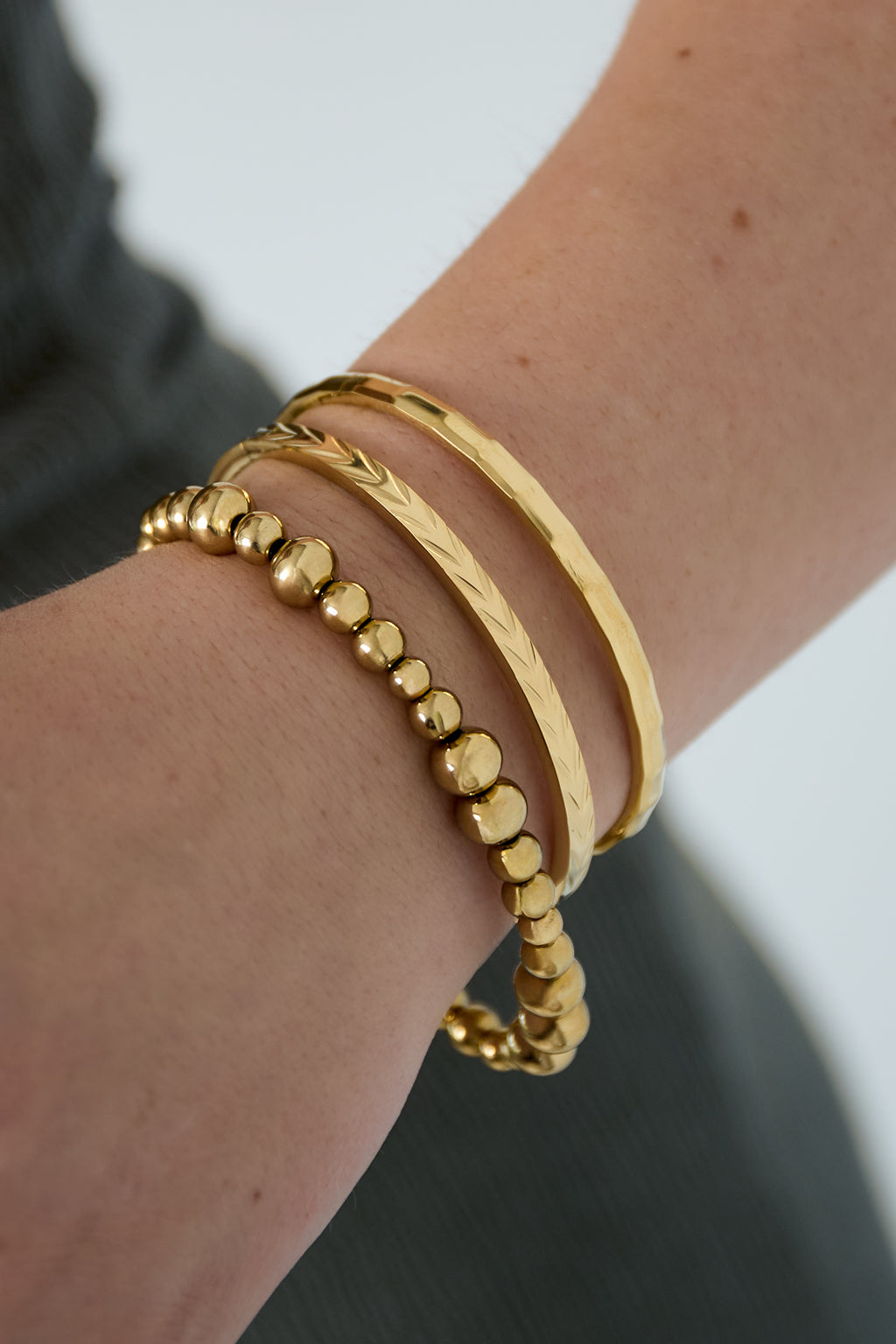 Evy - bandarmband Goud aan pols