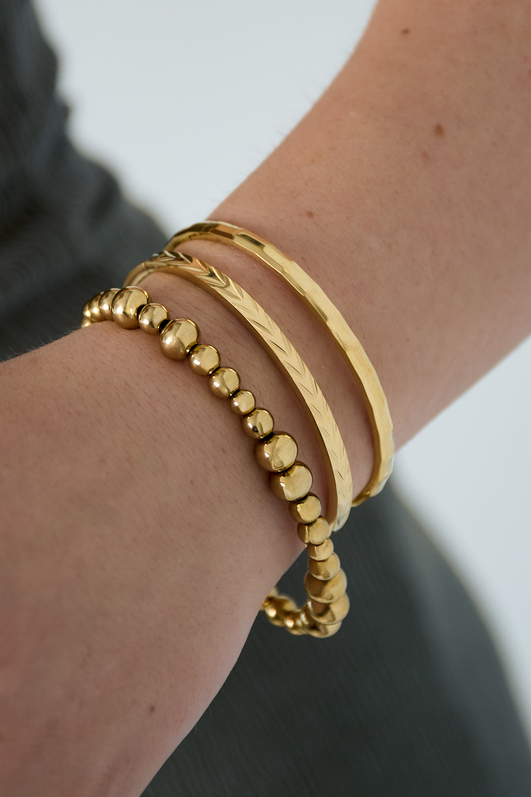 Evy - bandarmband Goud aan pols