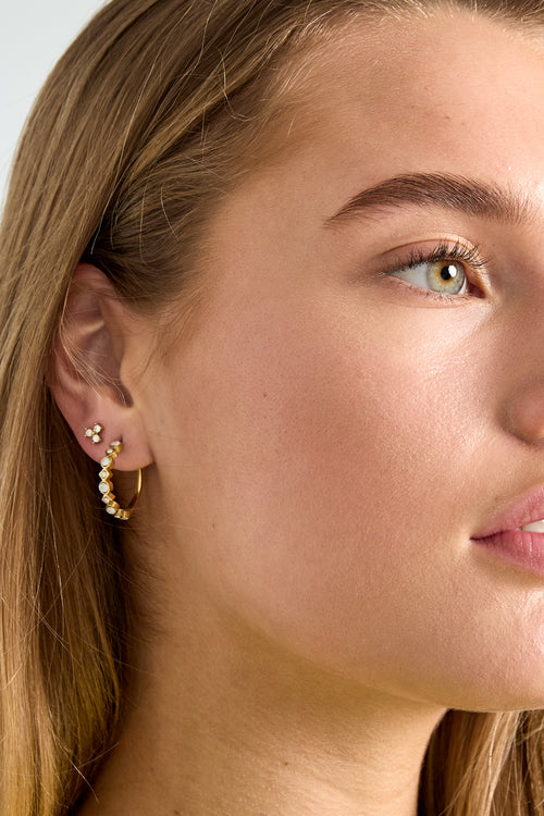 Tria - studs Goud aan oor