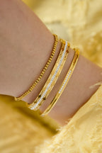 Tilly - schakelarmband Goud aan pols