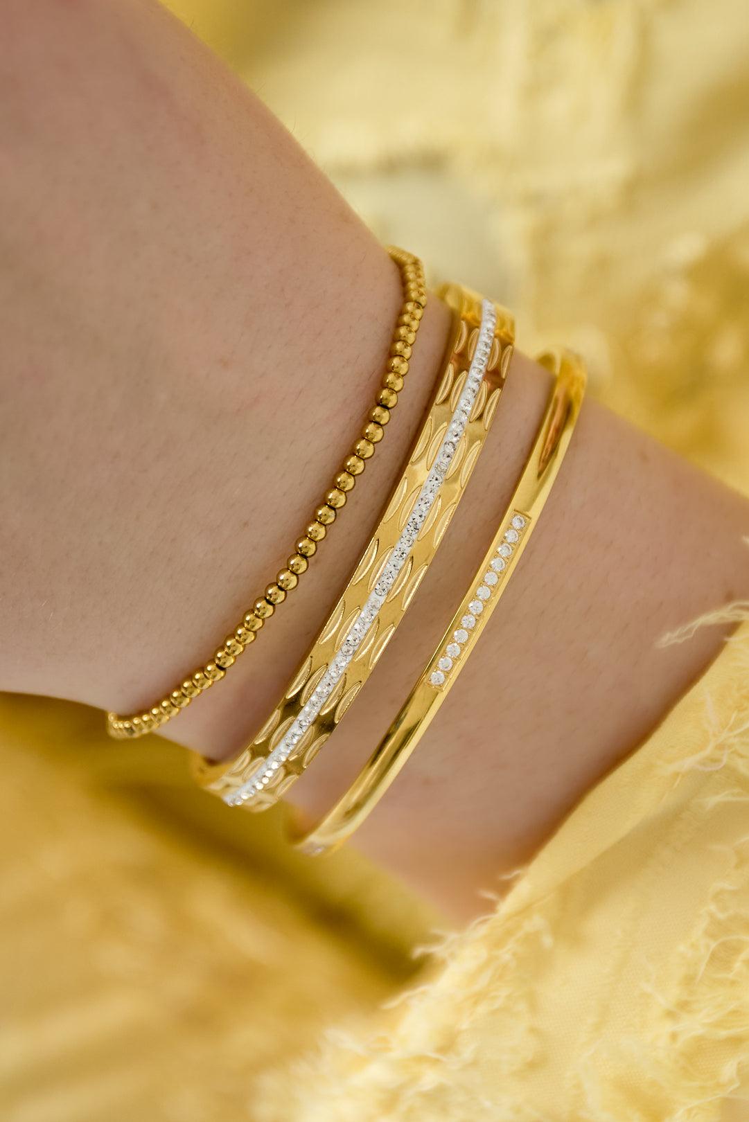 Tilly - schakelarmband Goud aan pols