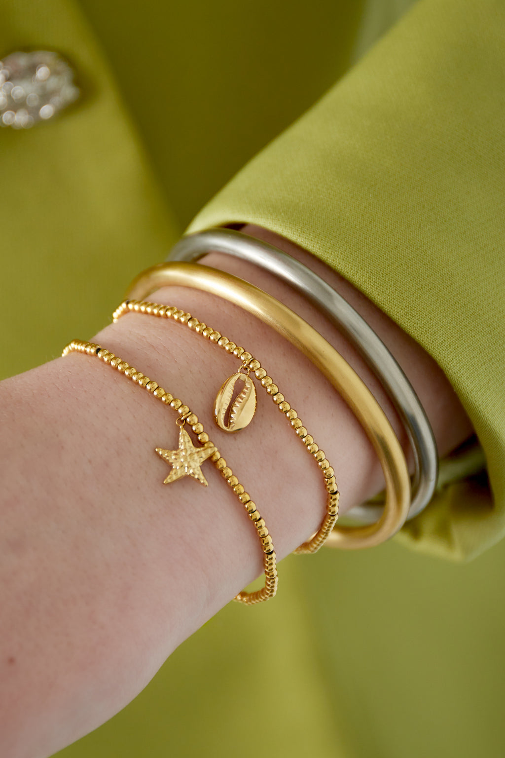Isla - armband Goud aan pols