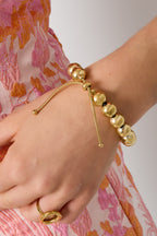 Bubble - schakelarmband Goud aan pols