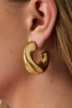 Marigold - statement creolen Goud aan oor